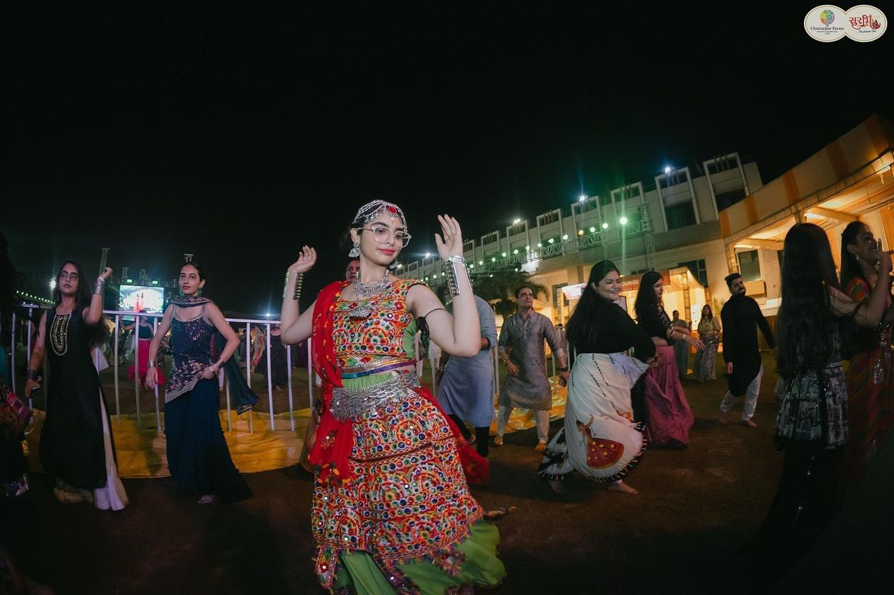 Women dancing garba in traditional dress at Surbhi Garba Dhoom Dandiya 2025, Chattarpur Farms, Nagpur