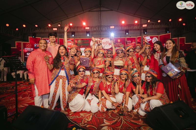 Winning women garba group celebrating on stage at Surbhi Dhoom Dandiya 2025